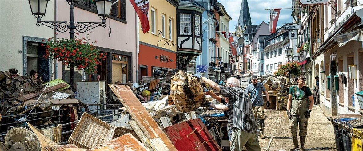 Water-damaged items are piled along the streets of a German town.
