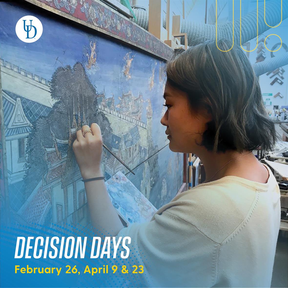 An image of a student working on a painting. Text: Decision Days - February 26, April 9 & 23.
