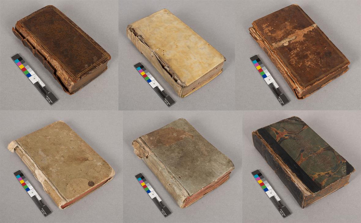 Six small books, all in states of disrepair and needing conservation treatment.