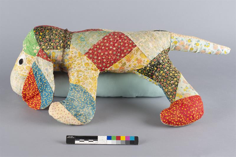 The patchwork animal seen in the previous image, with the damaged textiles repaired.