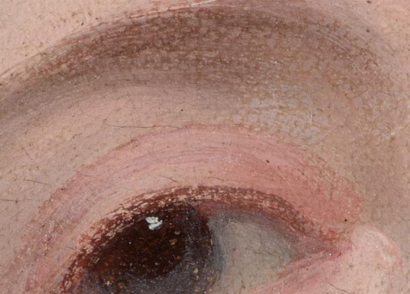 Close-up of a painted eye; rubbing of the paint has removed the top layers of pigment, leaving gaps in the brushstrokes.